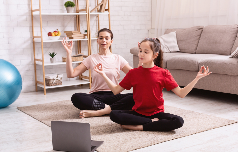 home-sports-mother-daughter-doing-yoga
