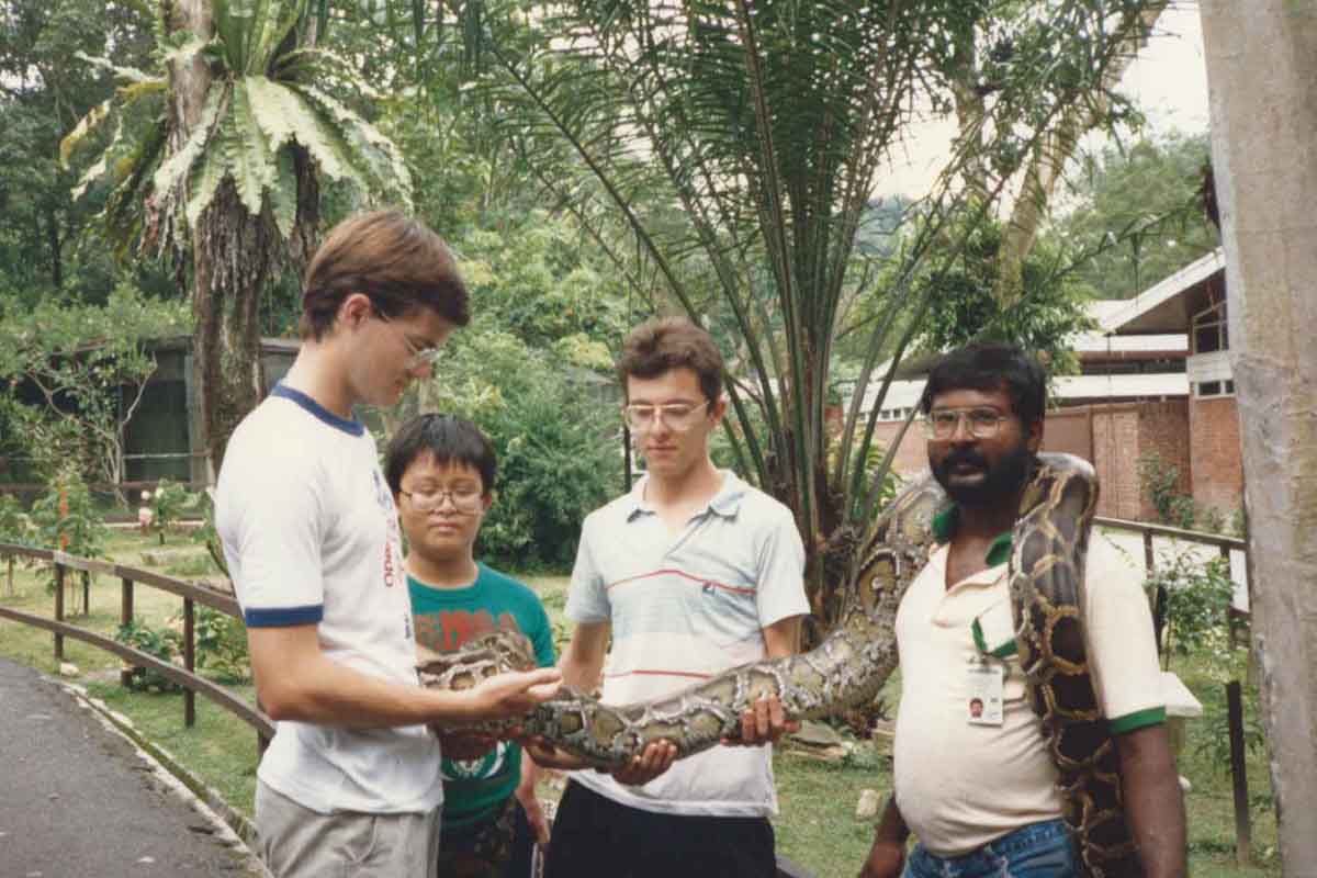 Andy left with brothers Neil and David holding python Kuala Lumpur late 80s