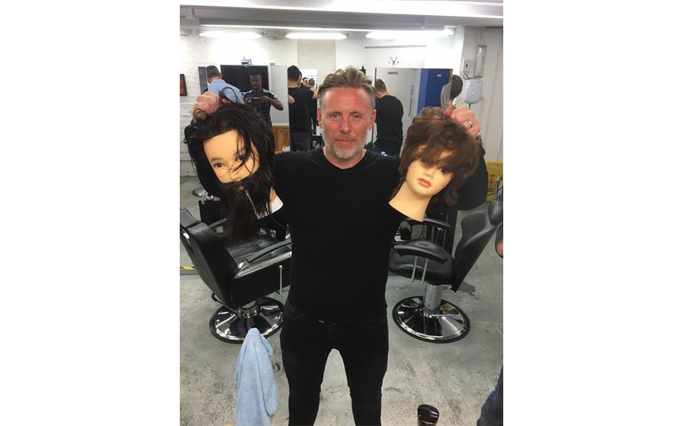 Paul Fox posing with mannequins
