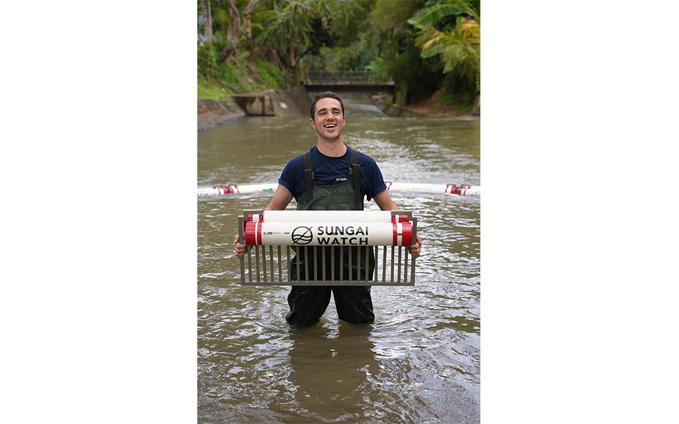 Gary holding a part of one of his self-designed barriers