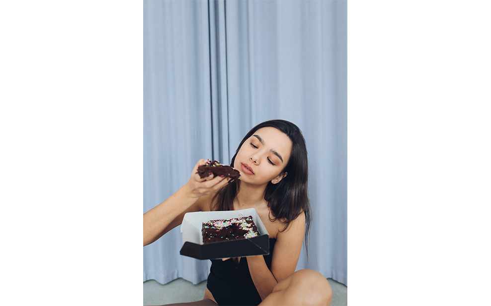 Woman and chocolate cake