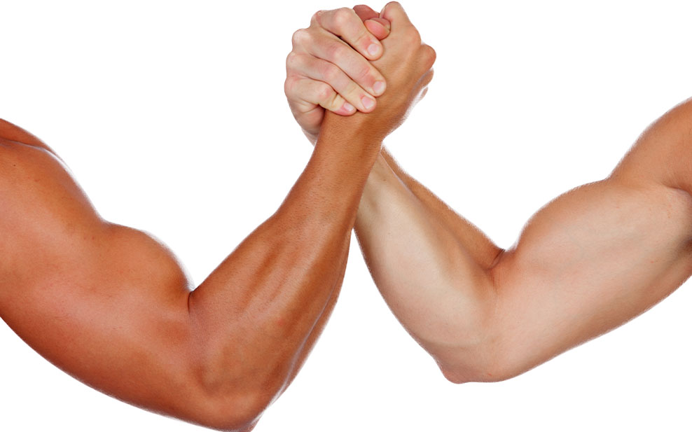 Two powerful men arm wrestling isolated on a white background